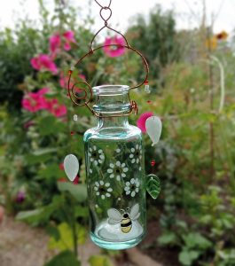 glass bottle painted with bee