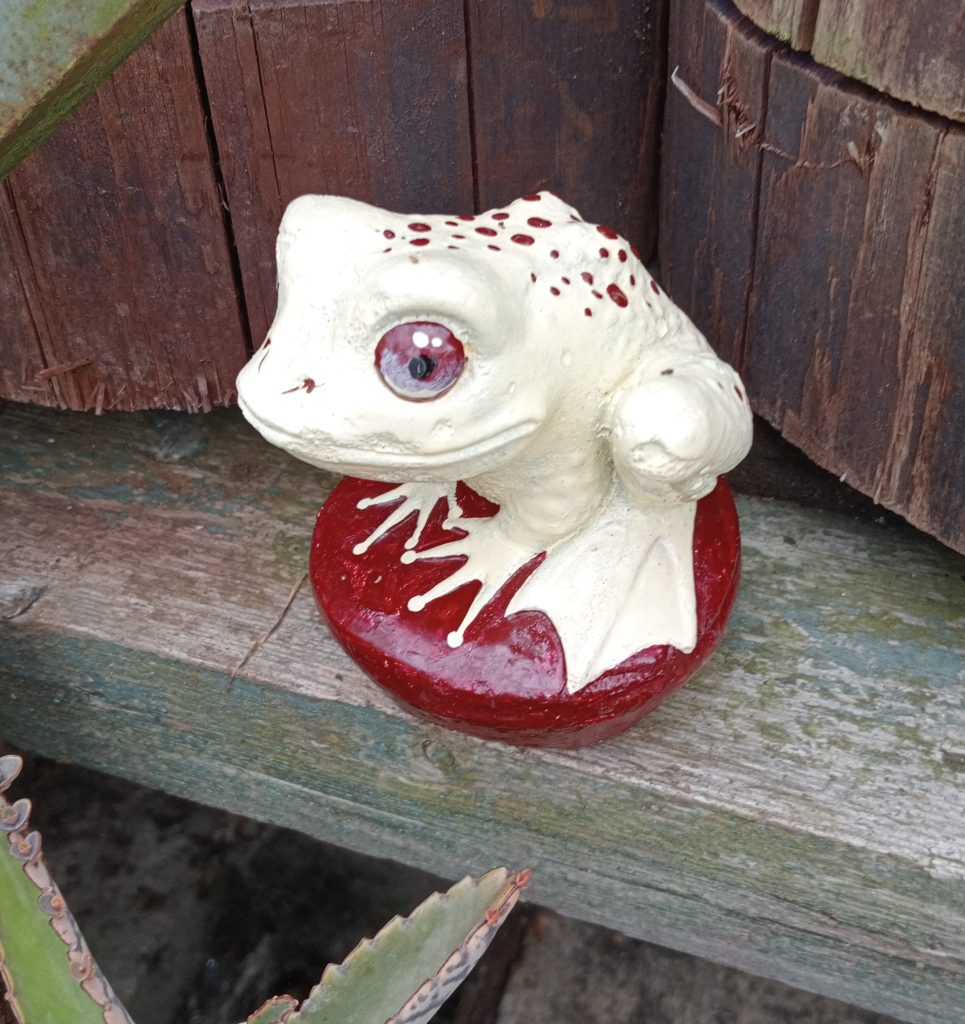 concrete frog with paintwork restored